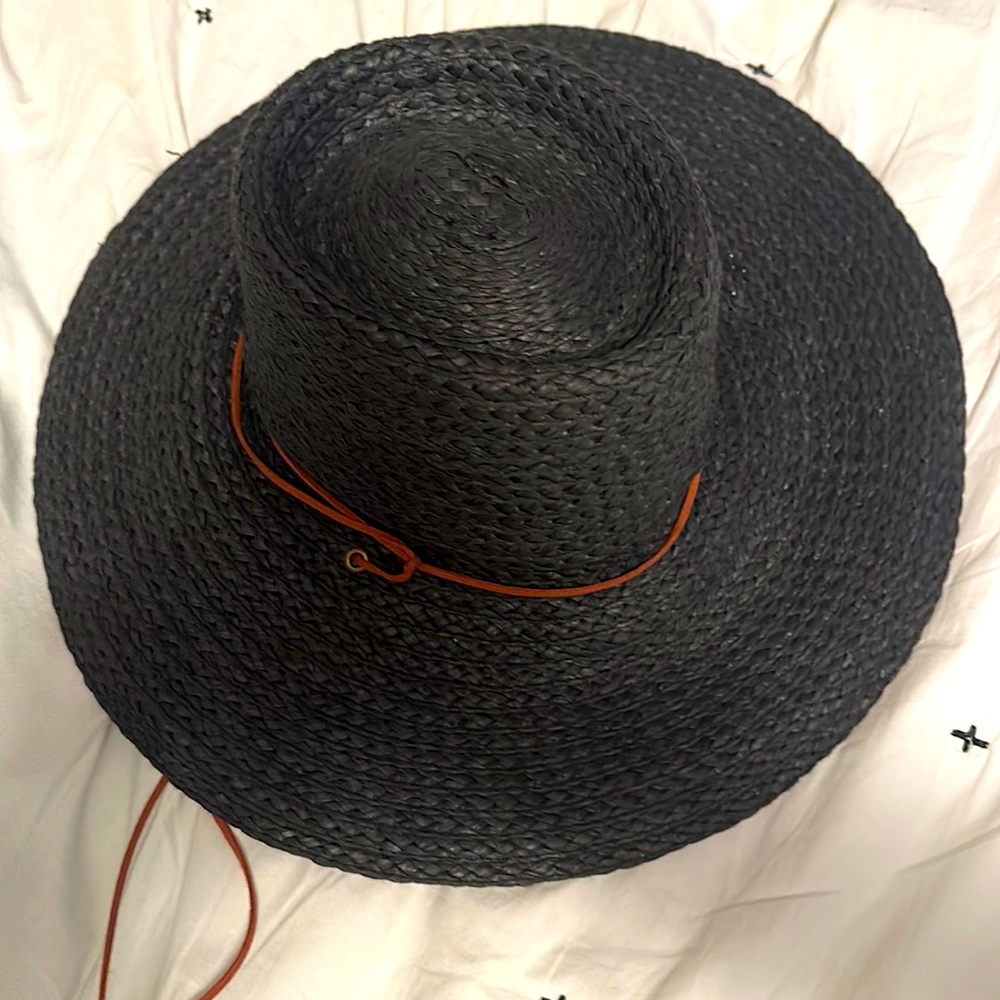 Adorable straw hat with leather strings!